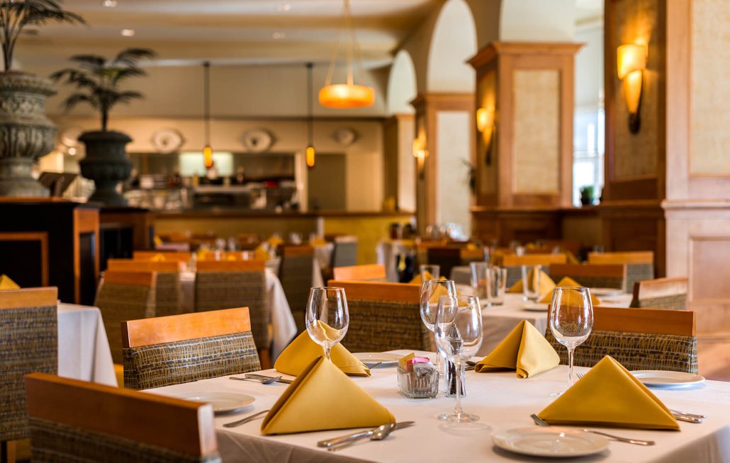 La Fontana Restaurant dining room at Hilton Santa Clara with elegant table settings and warm lighting near Levi’s Stadium