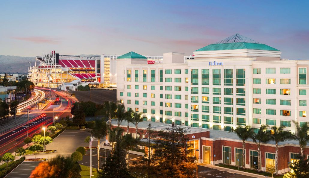 Hilton Santa Clara hotel exterior with Levi’s Stadium in background