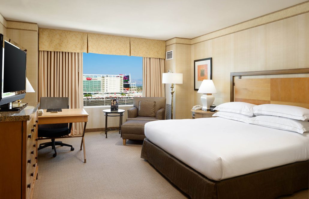 Hilton Santa Clara king room with Levi’s Stadium view and workspace, shown in Santa Clara hotel room tours.