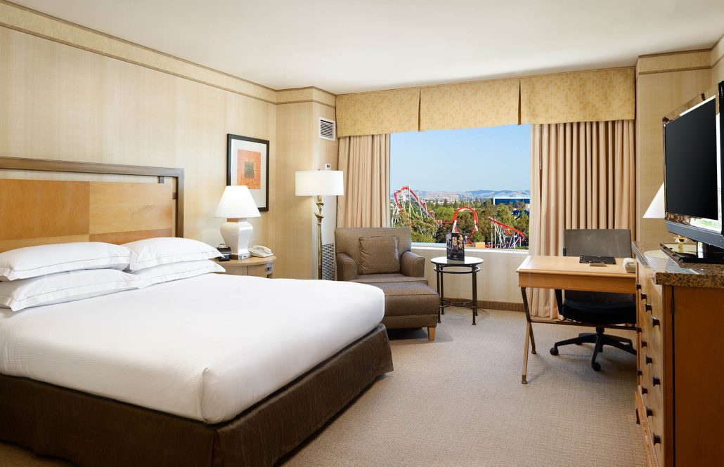 King mobility accessible hotel room at Hilton Santa Clara with roll-in shower and Santa Clara city view.