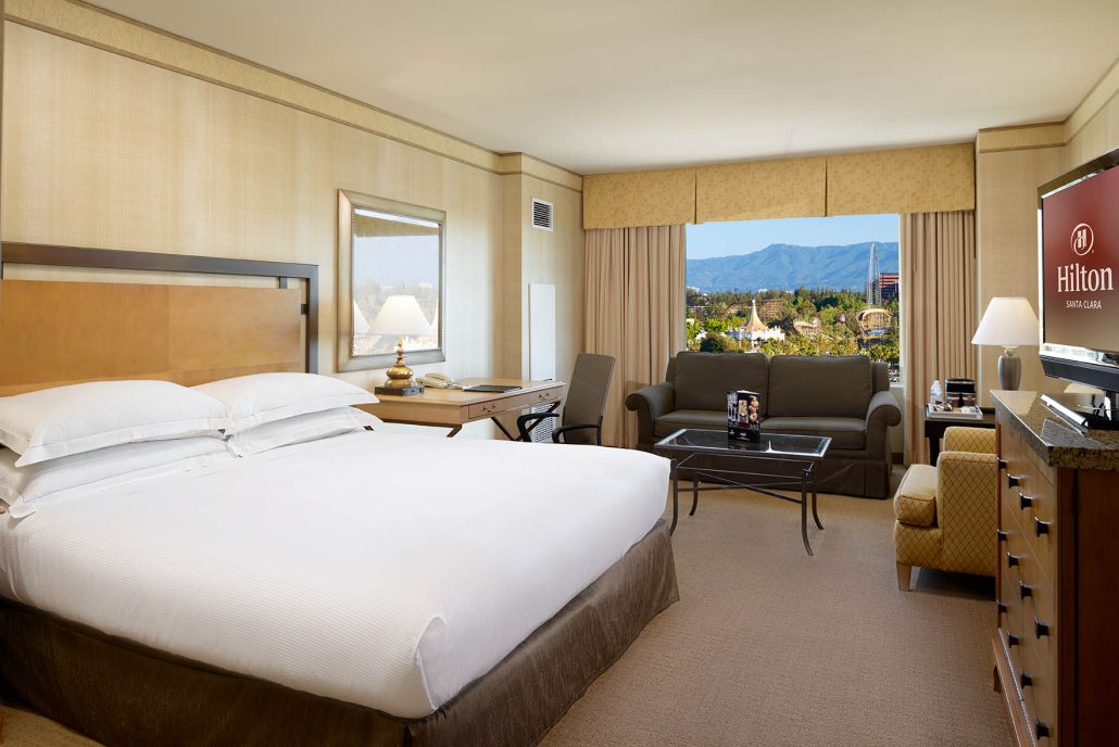 King superior guest room with sofa bed and city view at Hilton Santa Clara, featured in Santa Clara hotel room tours.