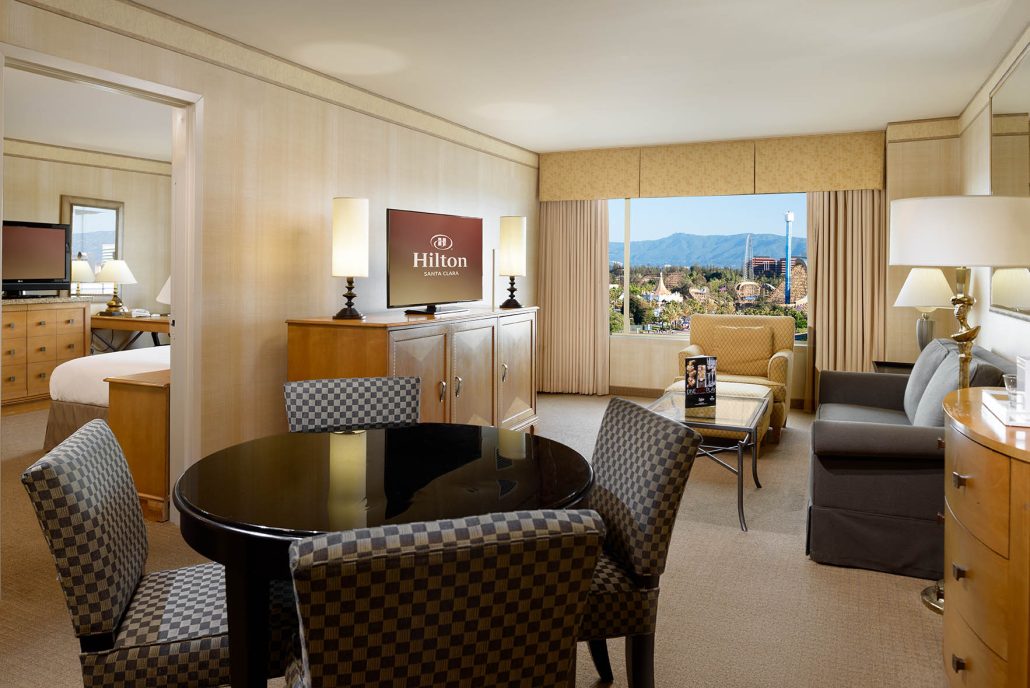 Spacious suite at Hilton Santa Clara with living area and Levi’s Stadium view – ideal Santa Clara hotel rooms for extended stays