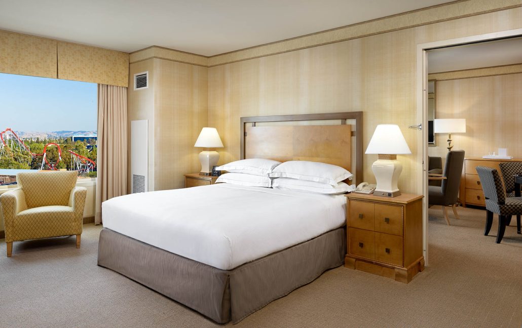 One-bedroom king suite at Hilton Santa Clara with private bedroom and living space, part of Santa Clara hotel suites.