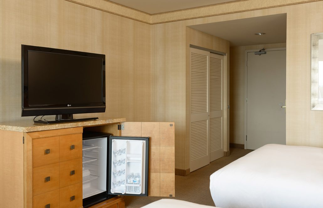 Two double beds in standard guest room at Hilton Santa Clara, featured in Santa Clara hotel room tours.